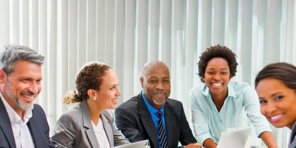 Experienced business people working together and smiling.