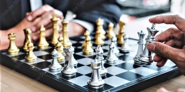 Business leaders playing chess.